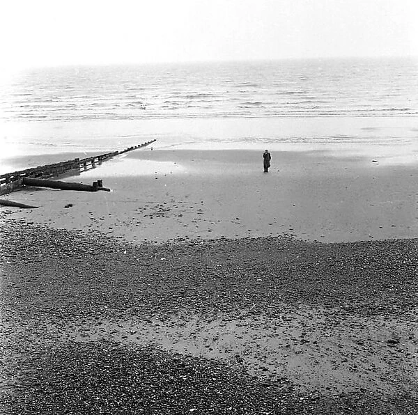 Solitary man on the beach at Eastbourne, Sussex