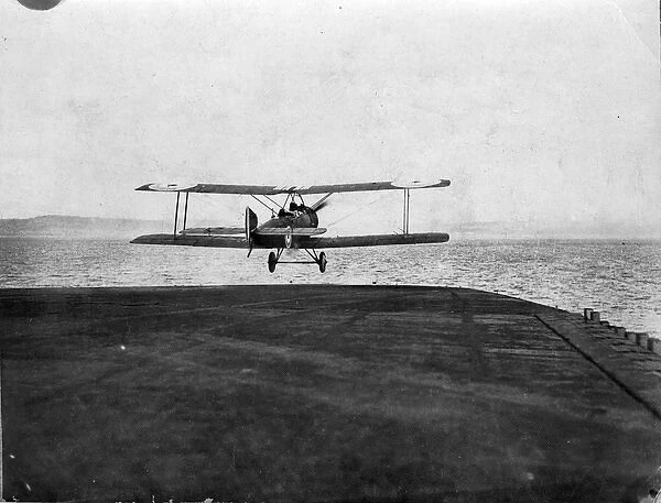 A Sopwith 1 1  /  2 Strutter takes-off from HMS Furious