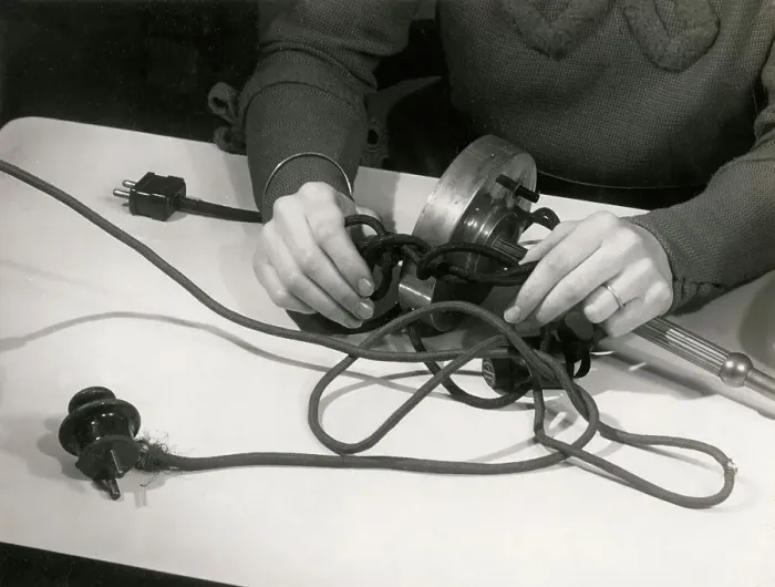 Framed Print : This sort of thing is bad for electric flexes. The fine strands of wire inside the rubber insulator will break an ultimately cause a breakdown or even electrocution. Date: 1930s Framed Print : This sort of thing is bad for electric flexes. The fine strands of wire inside the rubber insulator will break an ultimately cause a breakdown or even electrocution. Date: 1930s