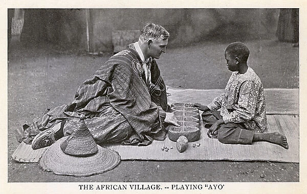 South Africa - European man and local boy play a game of Ayo