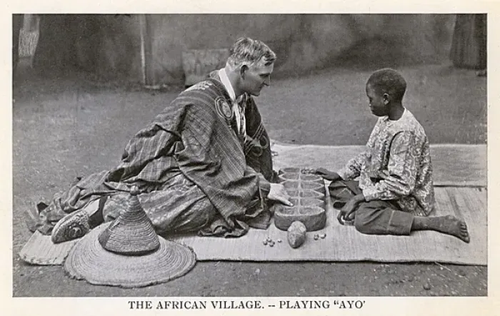 Framed Print : South Africa - European man and local boy play a game of Ayo Framed Print : South Africa - European man and local boy play a game of Ayo