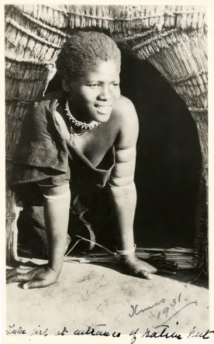 Framed Print : South Africa - smiling Zulu girl kneeling in her doorway Framed Print : South Africa - smiling Zulu girl kneeling in her doorway