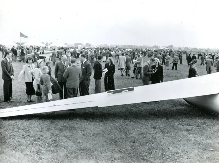 Framed Print : Spectators in front of the wing of a Sky Sailplane at th? Framed Print : Spectators in front of the wing of a Sky Sailplane at th?
