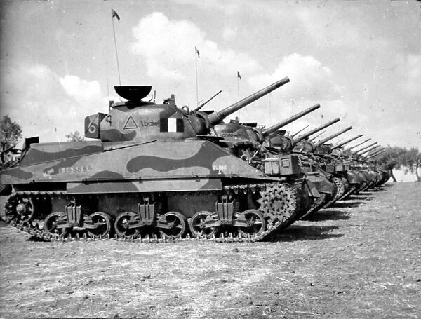 A Sqdn Tanks. Photograph: A Sqdn Tanks. Shows a row of tanks