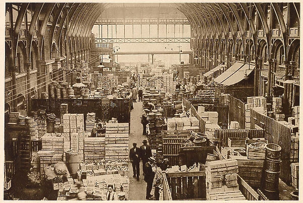 Stalls with wooden partitions selling fresh fruit wholesale. Date: 1937