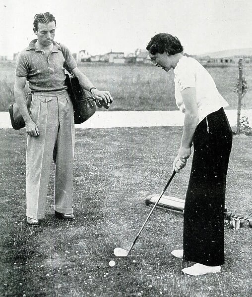 Stanley Matthews and wife playing golf in Rhyl