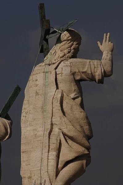 Statue of Jesus on the roof of St. Peters Basilica. Vatica