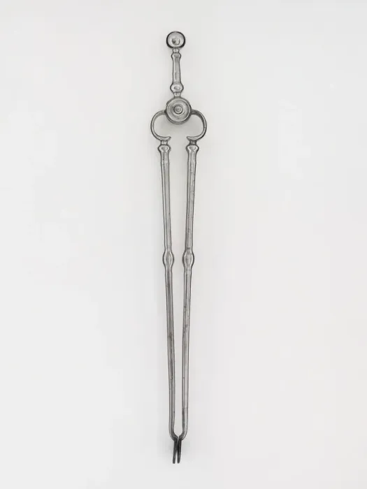 Framed Print : Tongs. Steel tongs, from a set of fire irons, with shafts with baluster Framed Print : Tongs. Steel tongs, from a set of fire irons, with shafts with baluster