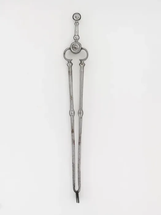 Framed Print : Tongs. Steel tongs, from a set of fire irons, with shafts with baluster Framed Print : Tongs. Steel tongs, from a set of fire irons, with shafts with baluster