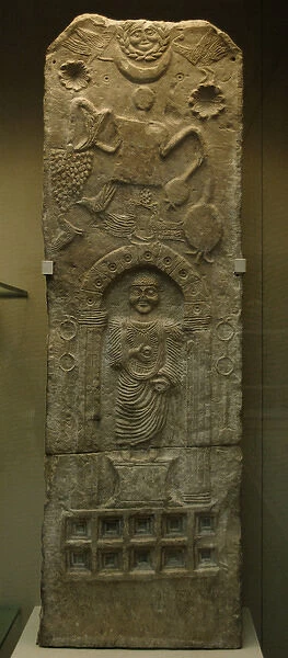 Stela relief depicting a male figure in a niche and a Tanit
