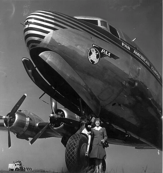 Stewardess Janet Pflug in front of a Douglas DC-4