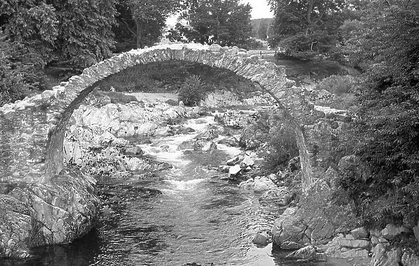 Stone footbridge over a mountain beck