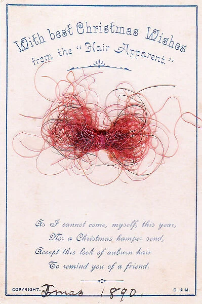 Strands of red hair with comic verse on a Christmas card