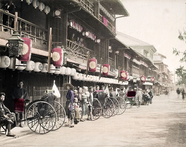Street filled with rickshaws, jinrikishas, Japan, c. 1890 s