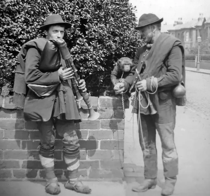 Framed Print : Street musicians with bagpipes and monkey Framed Print : Street musicians with bagpipes and monkey