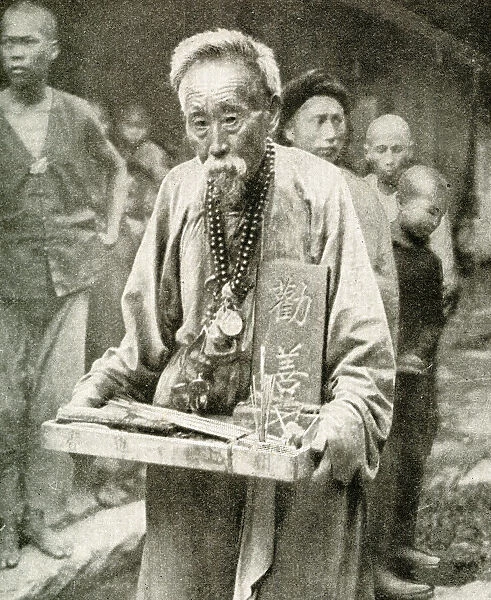 Street pharmacist with tray of drugs, China, East Asia