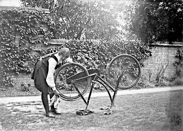 Student cleaning bicycle