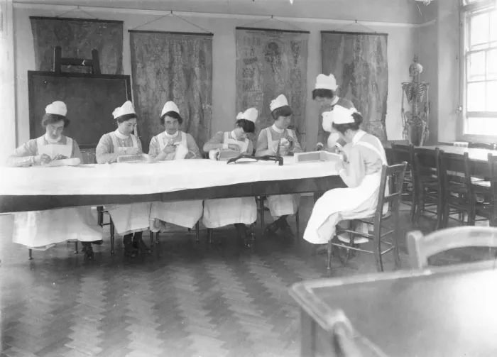 Framed Print : Student nurses working with bandages Framed Print : Student nurses working with bandages