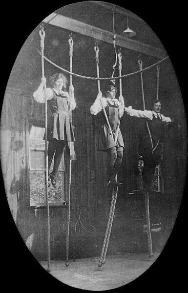 Students using ropes in gym