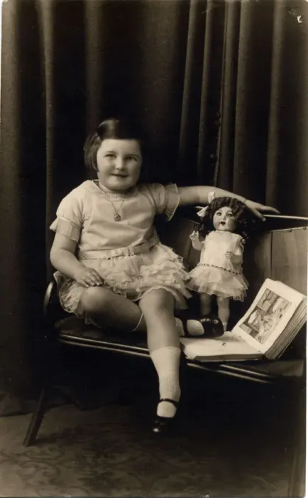 Framed Print : Studio photograph of a little girl pictured with a doll and picture book Framed Print : Studio photograph of a little girl pictured with a doll and picture book