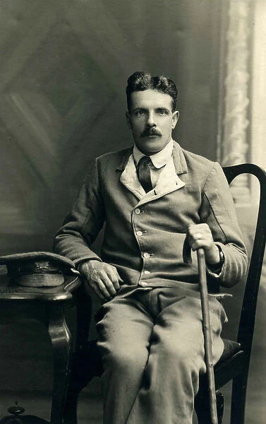 Studio photograph of sitting hospital patient