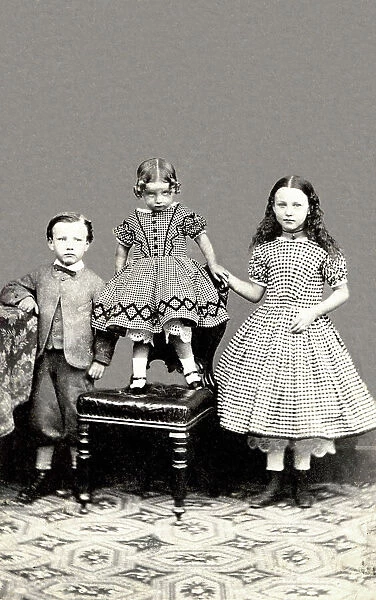 Studio portrait of three children on a carte de visite