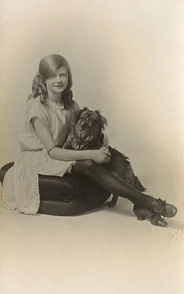 Studio portrait, girl with pug dog