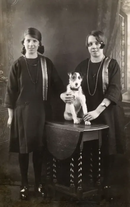 Framed Print : Studio portrait, two girls with terrier