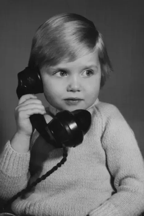 Framed Print : Studio portrait, little boy on the phone Framed Print : Studio portrait, little boy on the phone