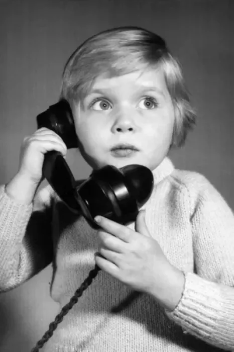 Framed Print : Studio portrait, little boy on the phone Framed Print : Studio portrait, little boy on the phone