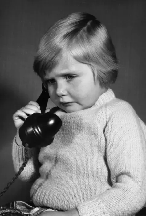 Framed Print : Studio portrait, little boy on the phone Framed Print : Studio portrait, little boy on the phone