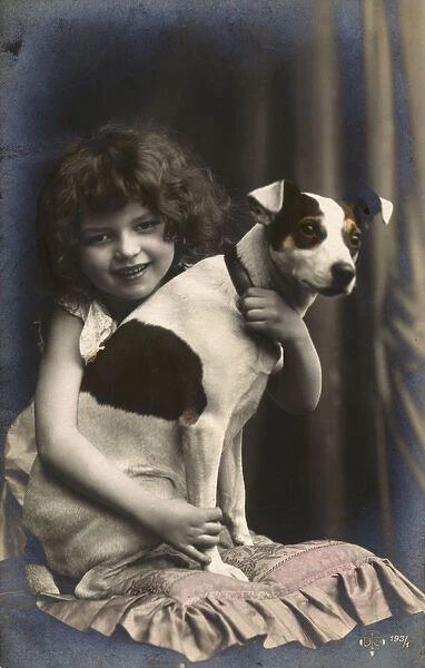 Studio portrait, little girl with her dog, France