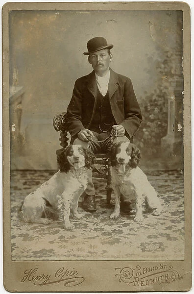 Studio portrait, man with his dogs