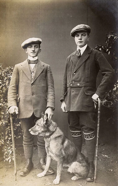 Studio portrait, two men with a dog, Germany
