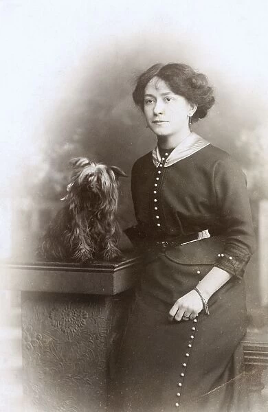 Studio portrait, woman with Yorkshire Terrier