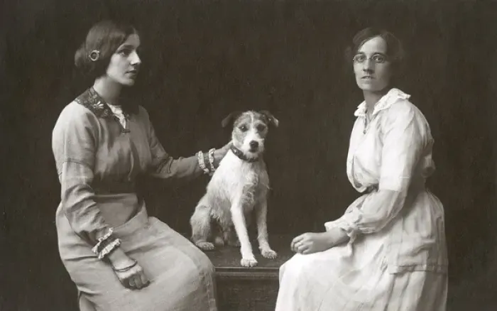 Framed Print : Studio portrait, two women with dog Framed Print : Studio portrait, two women with dog