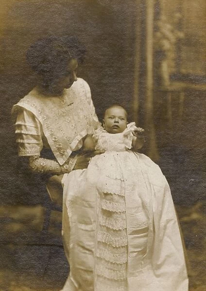 Studio portrait, young mother and baby