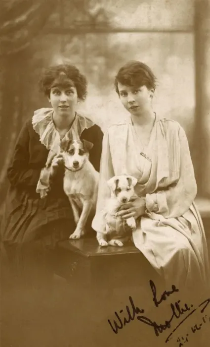 Framed Print : Studio portrait, two young women with dog and puppy Framed Print : Studio portrait, two young women with dog and puppy