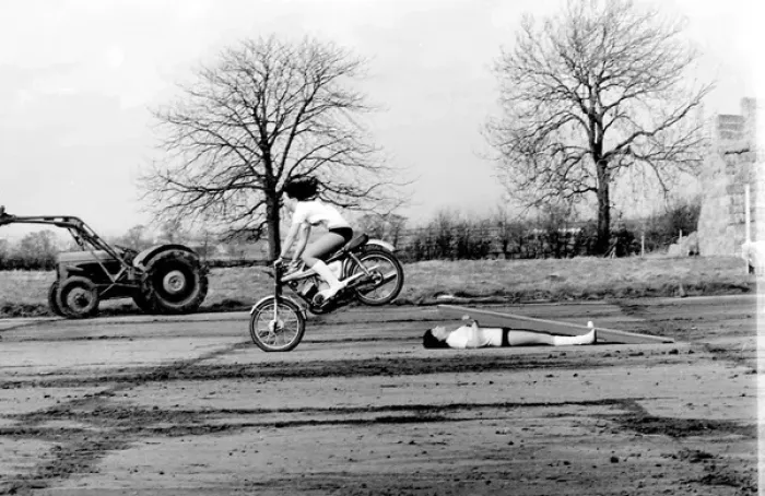 Framed Print : Stunt woman rides over wooden plank Framed Print : Stunt woman rides over wooden plank