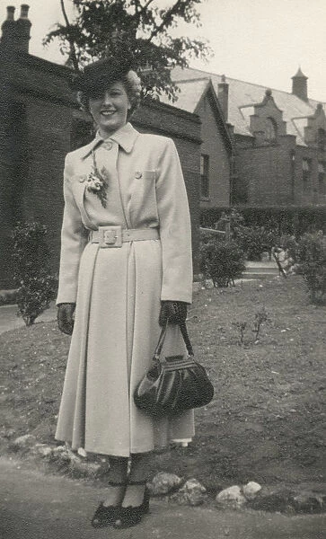 Stylish woman in an elegant coat and handbag