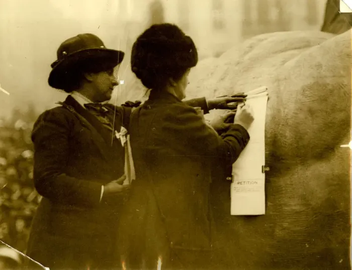 Framed Print : Two suffragettes signing a petition Framed Print : Two suffragettes signing a petition