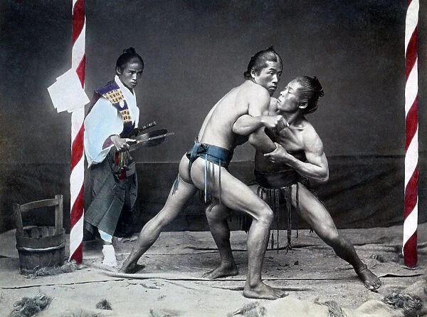 Sumo wrestlers and referee, Japan, circa 1890. Date: circa 1890