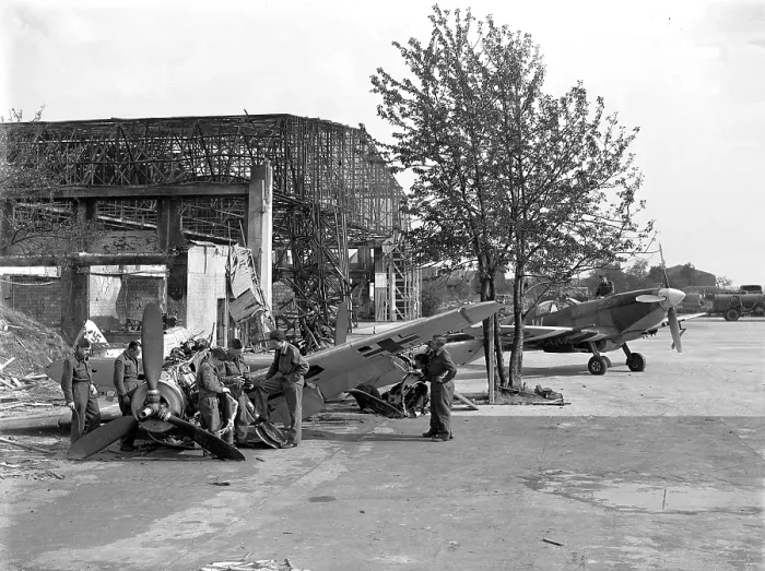 Framed Print : Supermarine Spitfire MkIX with wrecked Messerschmitt Bf 109G Framed Print : Supermarine Spitfire MkIX with wrecked Messerschmitt Bf 109G