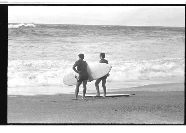 Surfers on the beach at Biarritz, France