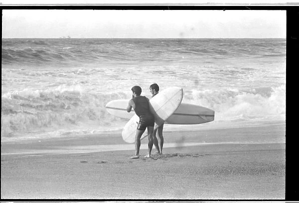 Surfers on the beach at Biarritz, France