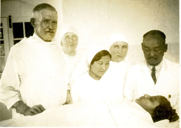 Surgeon, nurses and anaesthetist with patient