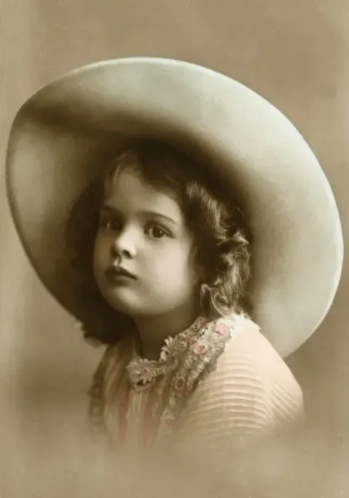 Framed Print : A sweet little girl wearing a wide-brimmed hat Framed Print : A sweet little girl wearing a wide-brimmed hat