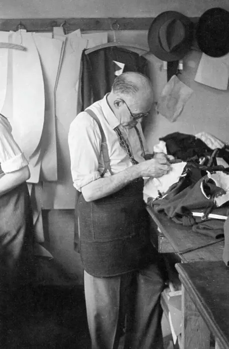 Framed Print : Tailor at work on a garment Framed Print : Tailor at work on a garment