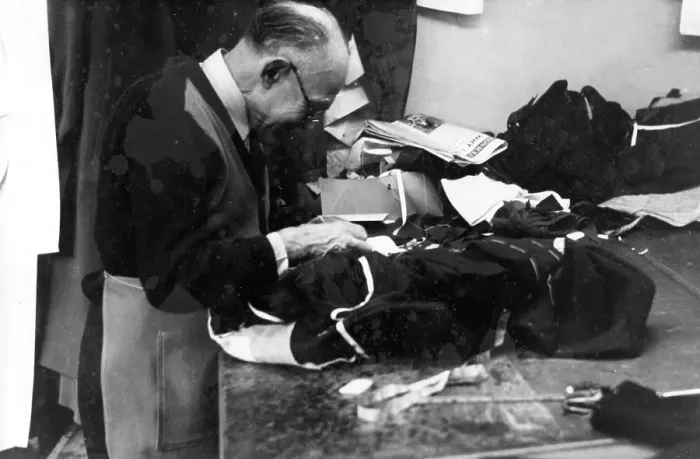 Framed Print : Tailor at work on a garment Framed Print : Tailor at work on a garment