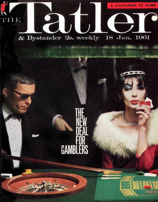 Framed Print : Tatler Front Cover - A man in a suit and sunglasses, and a black-haired woman in a red dress with a white fur collar are sitting at a roulette table Framed Print : Tatler Front Cover - A man in a suit and sunglasses, and a black-haired woman in a red dress with a white fur collar are sitting at a roulette table